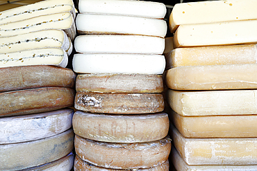 Traditional French cheese, Raclette and Morbier, mountain cheese for sale at market, France, Europe