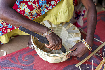 Adivasi woman making baskets in a village in Narmada district, Gujarat, India, Asia