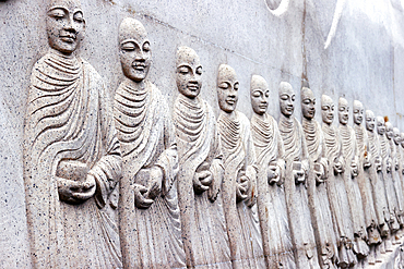 Carved relief showing Buddhist monks (Sangha) with alms bowls, Phap Vien Minh Dang Quang pagoda, Ho Chi Minh City, Vietnam, Indochina, Southeast Asia, Asia