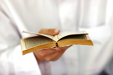 Muslim man reading an Arabic Holy Quran (Koran), Jamiul Azhar Mosque, Vietnam, Indochina, Southeast Asia, Asia