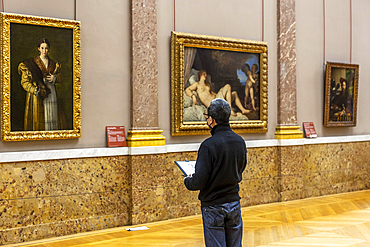 Man drawing a copy of a painting in the Louvre Museum, Paris, France, Europe