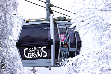 French Alps in winter, gondola lift at famous ski station, Saint Gervais Mont-Blanc village, Saint Gervais, Haute Savoie, France, Europe