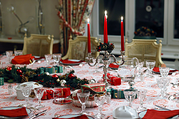 Table served for Christmas dinner in living room. Christmas celebration;