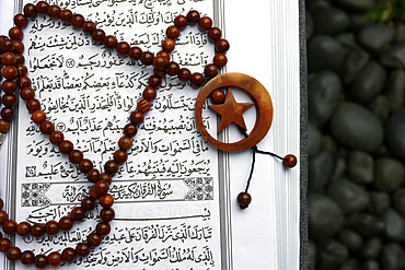 Islamic Holy Book Quran with rosary beads. Ramadan concept.