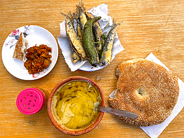 Soup and sardine meal served in the medina of Meknes, Morocco