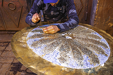 Craftsman at work in a workshop in Marrakesh, Morocco