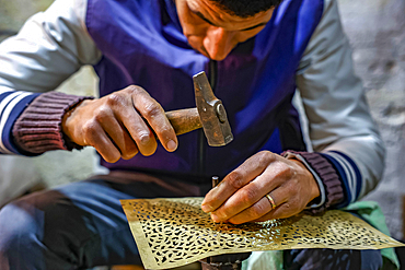 Craftsman at work in a workshop in Marrakesh, Morocco