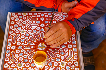 Craftsman at work in a workshop in Marrakesh, Morocco