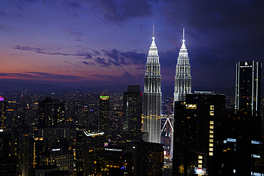 Petronas Twin Towers at night, the most famous twin skyscrapers in Kuala Lumpur. Malaysia, Asia.