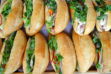 Banh Mi sandwich. Close-up of traditional Vietnamese baguette filled with pate, meat and vegetables. Ho Chi Minh City. Vietnam.