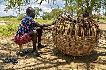 Making a rattan case in Loluk village, Napak district, Karamoja, Uganda