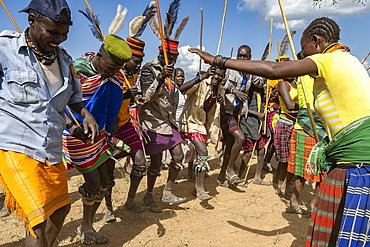 Group of dancers during the ceremony to bless the cattle before migration - Akiudakinangaatuk - in Lomiroo village, Karamoja region, Uganda