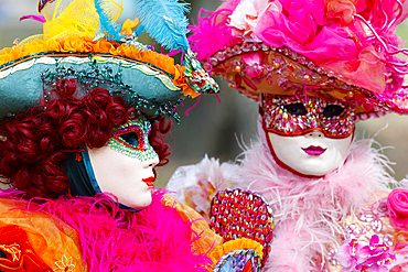 Women wearing traditional mask and costume. Annual venetian carnival of Annecy, Haute Savoie, France.