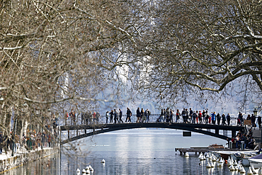 Tourists on the Pont des Amours - Lovers Bridge in Summer at Annecy Lake, Lac d'Annecy, France.