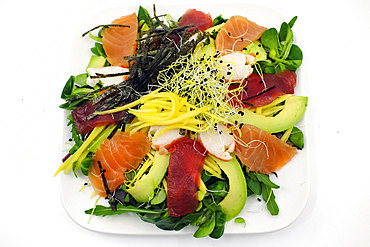Asian seafood salad. Tuna, salmon, shrimp, avocado and salad. Megeve.France.