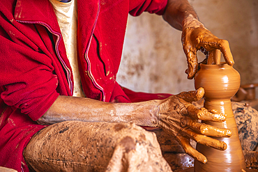 Potter at work in a workshop, Safi, Morocco