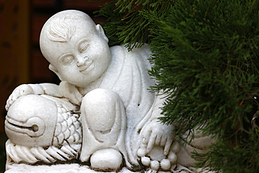 Buddhist temple. Marble buddhist monk statue in garden. Kontum. Vietnam.