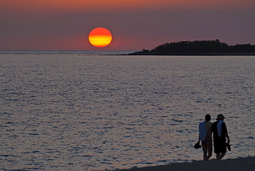 Walking couple at sunset, Playa Ancon, Trinidad, Cuba, West Indies, Caribbean, Central America