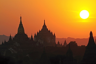 Silhouettes of the temples and pagodas of the ruined town of Bagan at sunset, Bagan, Myanmar, Asia