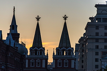 Silhouette of the History Museum and Resurrection Gate on Red Square at sunset, Moscow, Russia, Europe