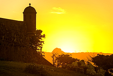 Backlit watchtower of the Fortress of Fortaleza San Felipe, Puerto Plata, Dominican Republic, West Indies, Caribbean, Central America