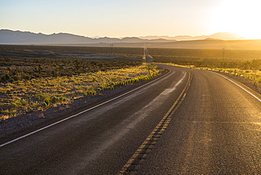 Long winding road at sunset in eastern Nevada, United States of America, North America