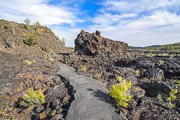 Walkway through cold lava in the Craters of the Moon National Park, Idaho, United States of America, North America