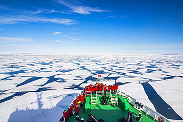 Expedition boat navigating through the pack ice in the Arctic shelf, Svalbard, Arctic