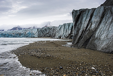 Gravel beach in front of a huge glacier in Hornsund, Svalbard, Arctic, Norway, Scandinavia, Europe 