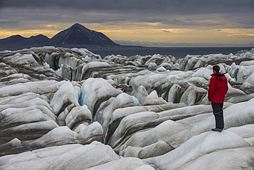 Man standing on a huge glacier in Hornsund, Svalbard, Arctic, Norway, Scandinavia, Europe 