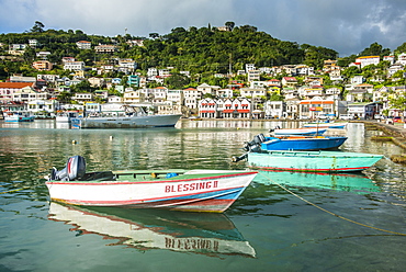 Little motoboat in the inner harbour of St. Georges, capital of Grenada, Windward Islands, West Indies, Caribbean, Central America