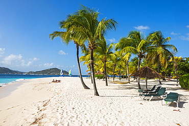 Palm fringed white sand beach on Palm Island with Union Island in the background, the Grenadines, St. Vincent and the Grenadines, Windward Islands, West Indies, Caribbean, Central America