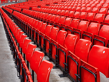 Rows of empty red stadium seats at Manchester United, Manchester, England, United Kingdom, Europe