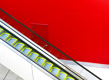 Escalator against a red painted wall, Houston, Texas, United States of America, North America