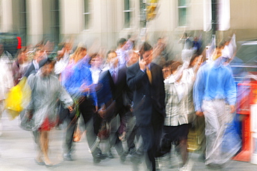 Group of people walking down street blurred, man on cell phone, Toronto, Ontario, Canada, North America