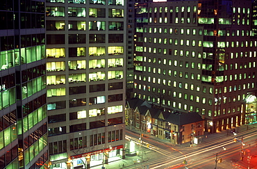 Evening scene of office towers and traffic at intersection, Toronto, Ontario, Canada, North America