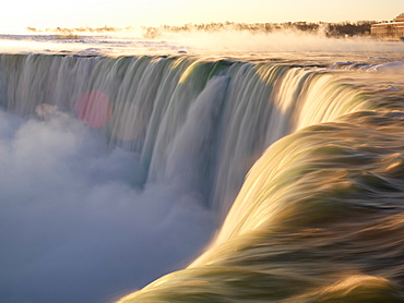 Brink of the Canadian Falls at sunrise in winter, Niagara Falls, Ontario, Canada, North America