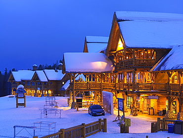 Wiskeyjack Ski Lodge in winter at dusk, Lake Louise, Banff National Park, Alberta, Canada, North America