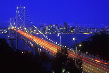 Oakland Bay Bridge illuminated at dusk with traffic streaks, San Francisco, California, United States of America, North America