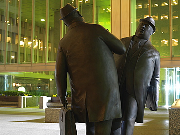 Encounter, a bronze sculpture by William McElcheran of two businessmen bumping into each other, Toronto, Ontario, Canada, North America