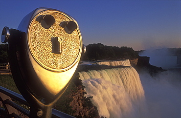 Viewing telescope illuminated by warm sunlight, American Falls, Niagara Falls, New York State, United States of America, North America