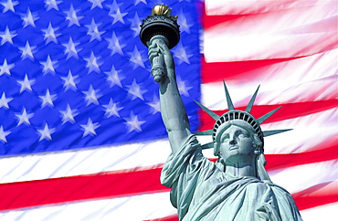 Statue of Liberty against American flag, New York City, New York, United States of America, North America