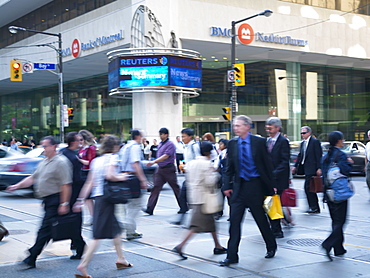 Pedestrians crossing street in the financial district of the city, Toronto, Ontario, Canada, North America