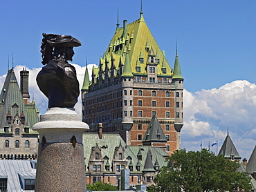 Statue of Pierre du Gua de Monts, co-founder of Quebec City and a view of Chateau Frontenac hotel, UNESCO World Heritage Site, Quebec City, Quebec, Canada, North America