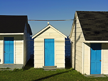 Motel units with brightly colored blue doors, L'Anse-a-Valleau, Gaspesie, Quebec, Canada, North America