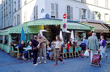 Older couple reading a map on Rue Cler, Paris, France, Europe