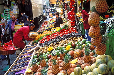 People shopping for fresh produce at a street  market on Rue Cler, Paris, France, Europe