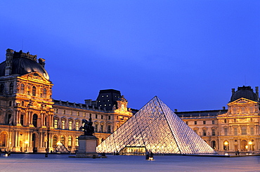 The Louvre and Pyramid at night, Paris, France, Europe