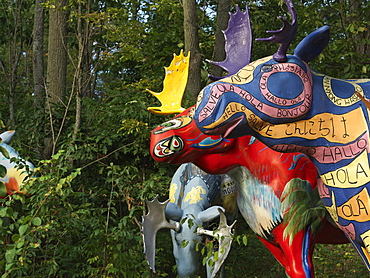 Painted moose sculptures in a forest setting, Ivy Lea, Ontario, Canada, North America