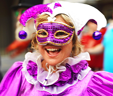 Second line parade with woman in mask, French Quarter, New Orleans, Louisiana, United States of America, North America